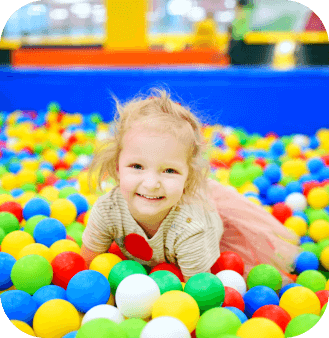 little girl playing with color balls