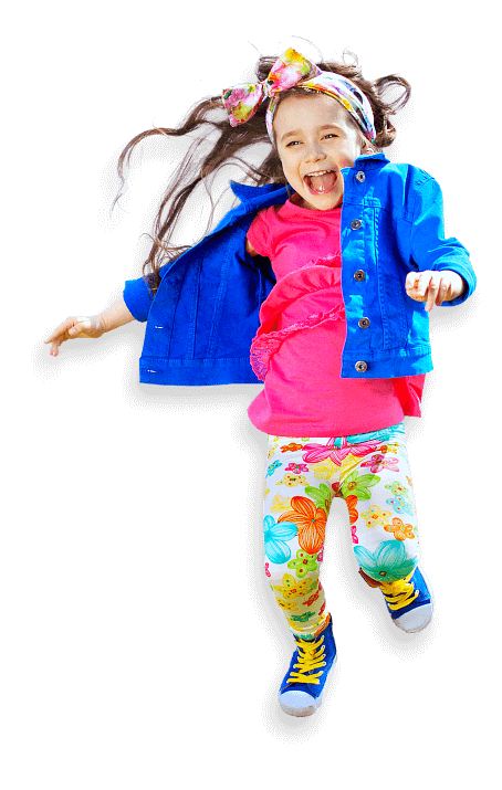 young girl laughing while jumping