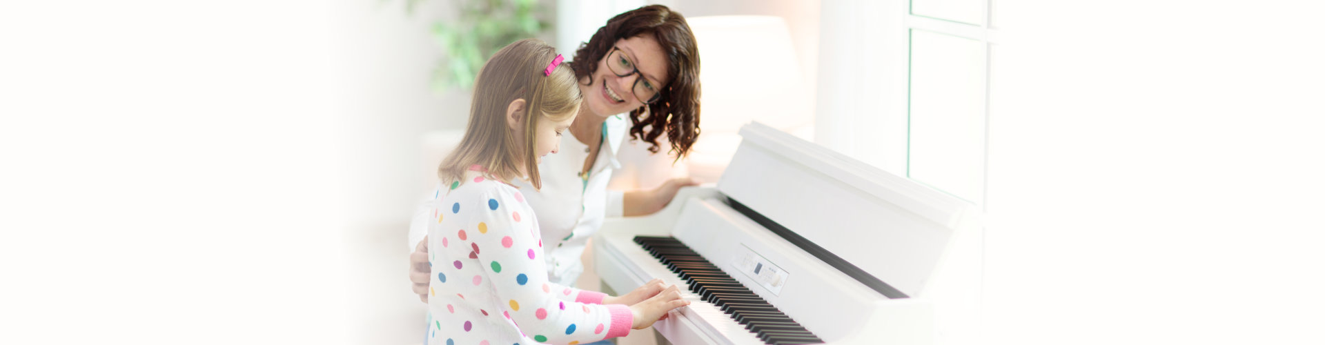 Child playing piano. Kids play music. Classical education for children. Art lesson. Little girl at white digital keyboard. Instrument for young student. Music class in school or at home