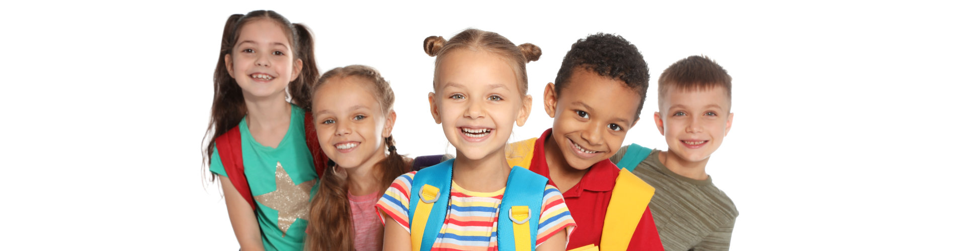 Group of little children with backpacks and school supplies on white background